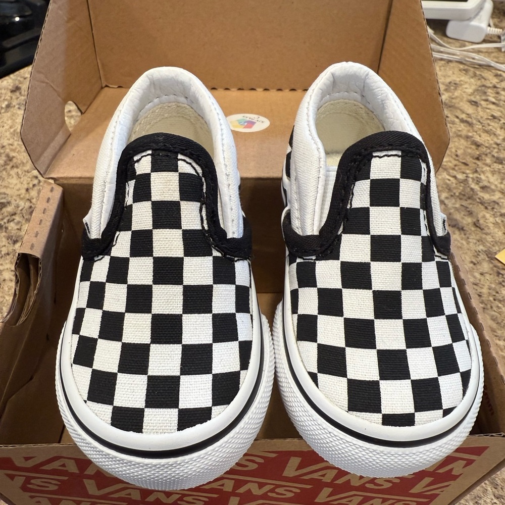 Vans Black and White Checkerboard Slip-On Sneakers